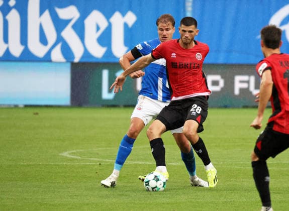 FC Hansa Rostock vs. SV Wehen Wiesbaden Rostock, September 5, 2026, Soccer 3. Liga FC Hansa Rostock vs. SV Wehen Wiesbaden Moritz Flotho (SV Wehen Wiesbaden) vs. Florian Carstens (FC Hansa Rostock) Rostock, Ostseestadion, Mecklenburg-Western Pomerania, Germany