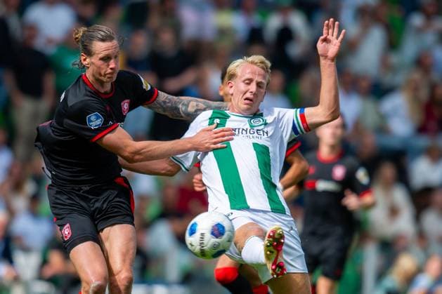 GRONINGEN , 06-09 2026 , Stadium Euroborg , season 2026 2027 , Dutch Eredivisie football , match between FC Groningen and FC Twente , picture shows FC Twente player Wout Weghorst FC Groningen player Thijmen Blokzijl Groningen - Twente  x206574741x Copyright: