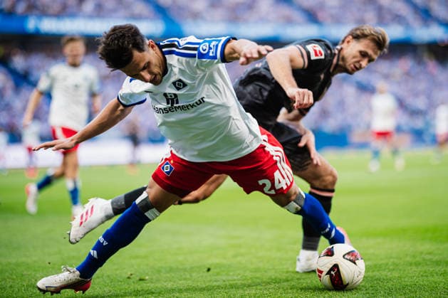 1. Bundesliga: Hamburger SV vs. 1. FSV Mainz 05, 06.09.2026 Zweikampf, Nicolas Capaldo (Hamburger SV, 24) gegen Stefan Posch (1. FSV Mainz 05, 4); Fußball, 1. Bundesliga, 2. Spieltag: Hamburger SV vs. 1. FSV Mainz 05 am 06.09.2026 im Volksparkstadion, Hamburg DFL REGULATIONS PROHIBIT ANY USE OF PHOTOGRAPHS AS IMAGE SEQUENCES AND OR QUASI-VIDEO. *** 1 Bundesliga: Hamburger SV vs. 1 FSV Mainz 05, September 6, 2026; Tackle: Nicolas Capaldo (Hamburger SV, 24) vs. Stefan Posch (1 FSV Mainz 05, 4); Soccer, 1st Bundesliga, Matchday 2: Hamburger SV vs. 1st FSV Mainz 05 on September 6, 2026, at the Volksparkstadion, Hamburg. DFL regulations prohibit any use of photographs as image sequences and or quasi-video. Copyright: xBEAUTIFULxSPORTS Tonhäuserx