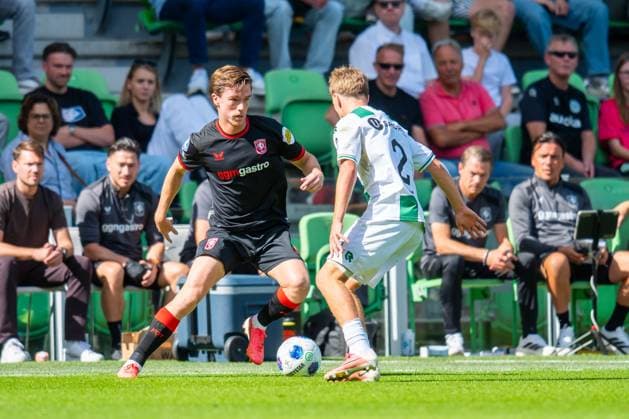 GRONINGEN , 06-09 2026 , Stadium Euroborg , season 2026 2027 , Dutch Eredivisie football , match between FC Groningen and FC Twente , picture shows FC Twente player Daan Rots FC Groningen player Wouter Prins Groningen - Twente  x206581744x Copyright: