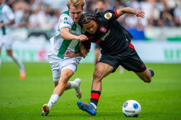 GRONINGEN , 06-09 2026 , Stadium Euroborg , season 2026 2027 , Dutch Eredivisie football , match between FC Groningen and FC Twente , picture shows Fc Groningen player Jorg Schreuders FC Twente player Filip Thorvaldsen Groningen - Twente  x206581824x Copyright: