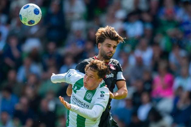 GRONINGEN , 06-09 2026 , Stadium Euroborg , season 2026 2027 , Dutch Eredivisie football , match between FC Groningen and FC Twente , picture shows FC Groningen player Thom van Bergen FC Twente player Robin Propper Groningen - Twente  x206583748x Copyright: