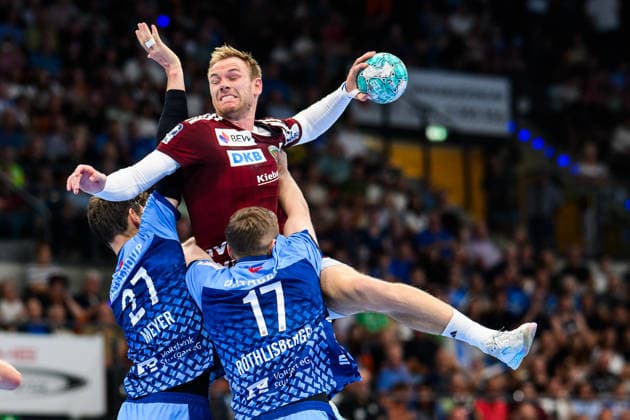 TVB Stuttgart vs. Füchse Berlin, Handball 1 Bundesliga, Men s, 2026–2027 Season, TVB Stuttgart vs. Füchse Berlin, Porsche Arena, Berlin s Mathias Gidsel (M) in action against Stuttgart s Philipp Meyer (L) and Stuttgart s Samuel Röthlisberger (R), Stuttgart, Porsche Arena, Baden-Württemberg, Germany