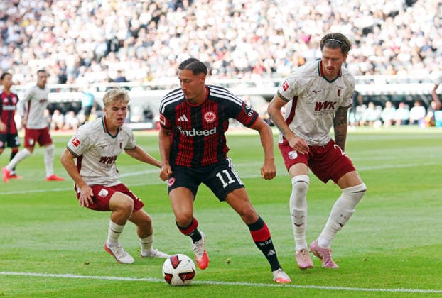06.09.2026, xovx, Fußball Fußball Bundesliga, Eintracht Frankfurt - FC Augsburg v.l. Hennes Behrens (FC Augsburg), Younes Ebnoutalib (Eintracht Frankfurt), Calvin Brackelmann (FC Augsburg) (DFL DFB REGULATIONS PROHIBIT ANY USE OF PHOTOGRAPHS as IMAGE SEQUENCES and or QUASI-VIDEO) emspor Frankfurt *** September 6, 2026, xovx, Soccer, Bundesliga, Eintracht Frankfurt vs. FC Augsburg (Hennes Behrens, FC Augsburg), Younes Ebnoutalib (Eintracht Frankfurt), Calvin Brackelmann (FC Augsburg). DFL and DFB regulations prohibit any use of photographs as image sequences and or quasi-video. Eintracht Frankfurt