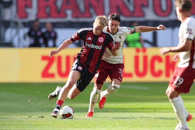 06.09.2026, Fussball Bundesliga, Eintracht Frankfurt - FC Augsburg, v.l., Jonathan Burkardt (Eintracht Frankfurt), Fabian Rieder (FC Augsburg) DFL DFB REGULATIONS PROHIBIT ANY USE OF PHOTOGRAPHS AS IMAGE SEQUENCES AND OR QUASI-VIDEO. xdcx *** September 6, 2026, Bundesliga Soccer, Eintracht Frankfurt vs. FC Augsburg, from left: Jonathan Burkardt (Eintracht Frankfurt), Fabian Rieder (FC Augsburg). DFL and DFB regulations prohibit any use of photographs as image sequences and or quasi-video. xdcx Copyright: HMBxMedia Claus