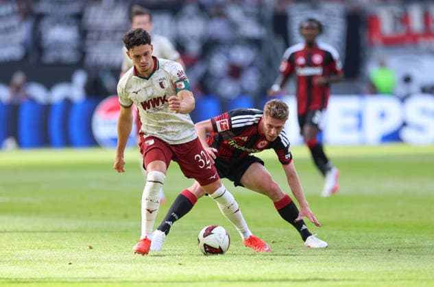 06.09.2026, Fussball Bundesliga, Eintracht Frankfurt - FC Augsburg, v.l., Fabian Rieder (FC Augsburg), Elias Baum (Eintracht Frankfurt) DFL DFB REGULATIONS PROHIBIT ANY USE OF PHOTOGRAPHS AS IMAGE SEQUENCES AND OR QUASI-VIDEO. xdcx *** September 6, 2026, Bundesliga Soccer, Eintracht Frankfurt vs. FC Augsburg, from left: Fabian Rieder (FC Augsburg), Elias Baum (Eintracht Frankfurt). DFL and DFB regulations prohibit any use of photographs as image sequences and or quasi-video. xdcx Copyright: HMBxMedia Claus