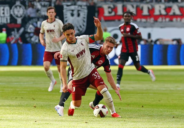 06.09.2026, xovx, Fußball Fußball Bundesliga, Eintracht Frankfurt - FC Augsburg v.l. Fabian Rieder (FC Augsburg), Elias Baum (Eintracht Frankfurt) (DFL DFB REGULATIONS PROHIBIT ANY USE OF PHOTOGRAPHS as IMAGE SEQUENCES and or QUASI-VIDEO) emspor Frankfurt *** September 6, 2026, xovx, Soccer, Bundesliga, Eintracht Frankfurt vs. FC Augsburg, Fabian Rieder (FC Augsburg), Elias Baum (Eintracht Frankfurt). DFL and DFB regulations prohibit any use of photographs as image sequences and or quasi-video. Eintracht Frankfurt