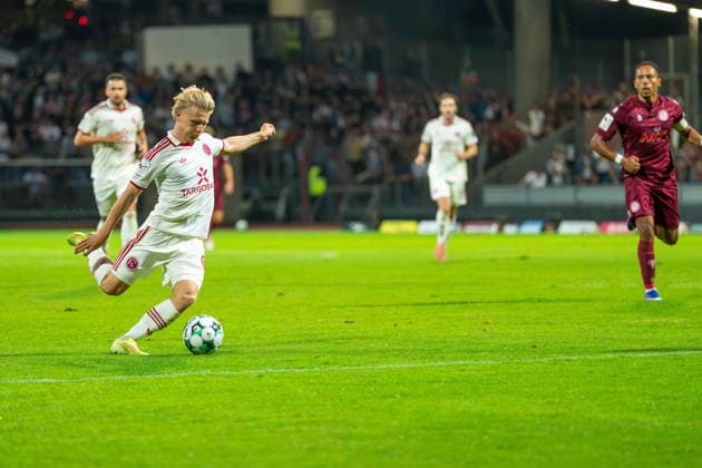 Andreas Mueller, Fortuna Düsseldorf, No. 06, taking a shot on goal; Robin Afamefuna, Fortuna Cologne, No. 22; Fortuna Cologne vs. Fortuna Düsseldorf; soccer; 3rd Division; Matchday 4; 2026–27 season; September 6, 2026; DFL regulations prohibit any use of photographs as image sequences and or quasi-video, Fortuna Cologne vs. Fortuna Düsseldorf, soccer, 3rd Division, Matchday 4, 2026–27 season, September 6, 2026, Cologne Copyright: xEibner-Pressefoto LukasxBaldygax EP_LBA