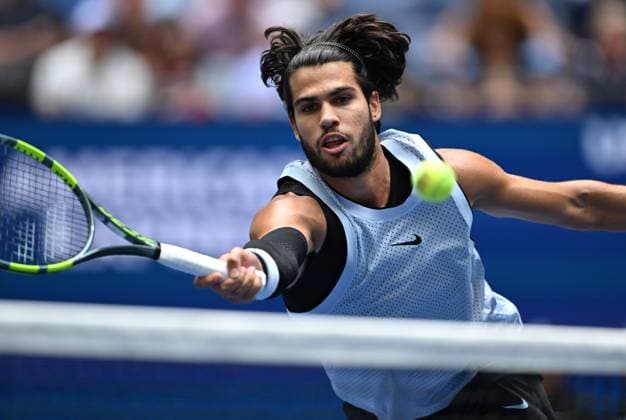 (260907) -- NEW YORK, Sept. 7, 2026 -- Carlos Alcaraz of Spain hits a return during the men s singles fourth round match between Carlos Alcaraz of Spain and Tommy Paul of the United States, at the 2026 US Open tennis championships in New York, the United States, Sept. 6, 2026. ) (SP)U.S.-NEW YORK-TENNIS-US OPEN-MEN S SINGLES LixRui 