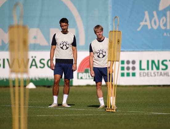 Soccer, Men s, Bavarian Regional League, 2026–2027 Season, TSV 1860 Munich, Training at Grünwalder Strasse 114, Damjan Dordan Training Facility; TSV 1860 Munich (left) with Fabio Wagner (TSV 1860 Munich, right) standing on the training field between dummies