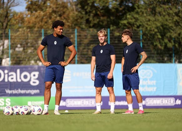 Soccer, Men s, Bavarian Regional League, 2026–2027 Season, TSV 1860 Munich, Training at Grünwalder Strasse 114, Training Facility: Arian Ortivero Calderon of TSV 1860 Munich, Fabio Wagner of TSV 1860 Munich, and Mark Gevorgyan of TSV 1860 Munich, standing on the training field from left to right