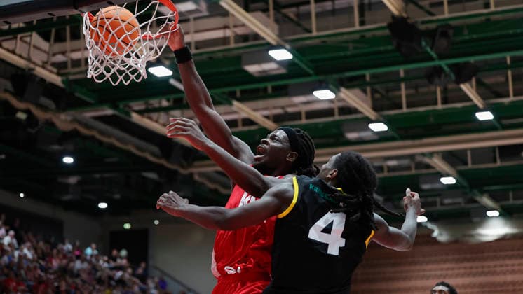 Pictured from left: Charles Thompson of the Würzburg Baskets, No. 32, dunking against Tyrel Morgan of the Kreisbau Kirchheim Knights, August 9, 2026, Fitness First Würzburg Baskets vs. Kreisbau Kirchheim Knights, exhibition game, Germany, 97072, tectake Arena Würzburg, Copyright: HMBxMedia xJulienxBecker