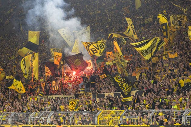 Dortmund, Germany, September 8, 2026 UEFA Champions League 2026–2027 Group Stage Match 1: Borussia Dortmund vs. FC Villarreal Pictured: Borussia Dortmund fans waving flags in the fan section of the South Stand and setting off pyrotechnics at Signal Iduna Park, North Rhine-Westphalia Copyright: xFotostandx xZeisingx