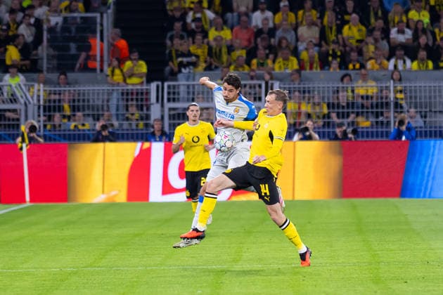 Dortmund, Germany, September 8, 2026; 2026–2027 UEFA Champions League group stage, Matchday 1: Borussia Dortmund vs. FC Villarreal. Pictured, from left, in a tackle: Santi Comesana (VIL) and Maximilian Beier (BVB) at Signal Iduna Park, North Rhine-Westphalia. Copyright: xFotostandx xZeisingx