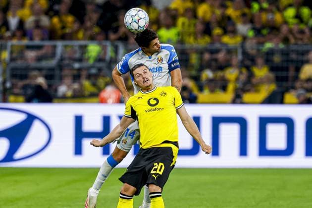 DORTMUND - Santi Comesana of Villarreal CF heads the ball with Marcel Sabitzer of Borussia Dortmund during the UEFA Champions League match between Borussia Dortmund and Villarreal CF at Signal Iduna Park on 08 September 2026 in Dortmund, Germany. MARCEL TER BALS ANP UEFA Champions League 2026 27 xVIxANPxSportx xMarcelxterxBalsxIVx 567684043 originalFilename: 567684043.jpg