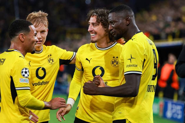 UEFA Champions League: Borussia Dortmund vs. Villarreal on September 8, 2026, at Signal Iduna Park in Dortmund—cheers, goal celebrations, goal scorers; Serhou Guirassy, Dortmund No. 9, celebrates with the team after scoring the goal that made it 2–1 MH