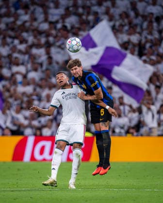 Real Madrid C.F. v FC Internazionale Milano - UEFA Champions League 2026 27 League Phase MD1 MADRID, SPAIN - SEPTEMBER 8: John Stones of FC Internazionale Milano (R) heads the ball against Kylian Mbappe of Real Madrid CF (L) during the UEFA Champions League 2026 27 League Phase MD1 match between Real Madrid C.F. and FC Internazionale Milano at Estadio Santiago Bernabeu on September 8, 2026 in Madrid, Spain. Madrid Estadio Bernabeu Madrid Spain Copyright: xAlbertoxGardinx AGardin_20260908_Foot_Cha_Rea_Mad_Inter_0249