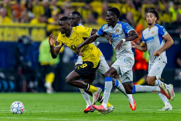 DORTMUND Borussia Dortmund forward Serhou Guirassy and Villarreal CF midfielder Tani Oluwaseyi during the UEFA Champions League match between Borussia Dortmund and Villarreal at BVB Stadion Dortmund on September 8, 2026, in Dortmund, Germany. Photo by DeFodi Images