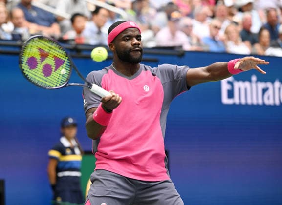 Frances Tiafoe returns a volley against Alex Michelsen during the quarter finals in Arthur Ashe Stadium at the 2026 US Open Tennis Championship held at the USTA Billie Jean King National Tennis Center in New York City on Tuesday, September 8, 2026.  NYP20260908523 LARRYxMARANO