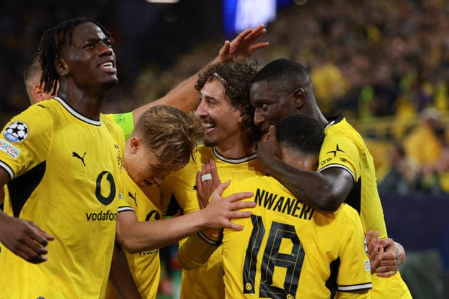 UEFA Champions League: Borussia Dortmund vs. Villarreal on September 8, 2026, at Signal Iduna Park in Dortmund—cheers, goal celebrations, Goal scorers: Serhou Guirassy (Dortmund 9) celebrates his goal to make it 2–1 alongside Fabio Silva (Dortmund 21), Ethan Nwaneri (Dortmund 18), and Joane Gadou (Dortmund 22) MH