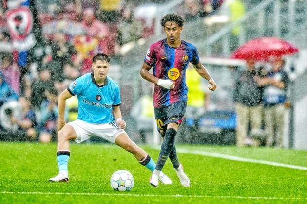 BARCELONA , 09-09-2026 , Spotify Camp Nou , season 2026 2027 , UEFA Champions League football , match between FC Barcelona, Barca and Feyenoord Rotterdam , picture shows Feyenoord player Mika Marmol and FC Barcelona player Lamine Yamal Barcelona - Feyenoord  x206776657x Copyright: