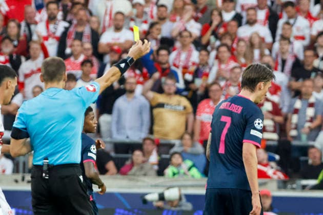 Kristoffer Askildsen of Viking Stavanger (No. 7) receives a yellow card from referee Nenad Minakovic (SRB), Germany, soccer, UEFA Champions League, Matchday 1, 2026–2027, VfB Stuttgart vs. Viking Stavanger, September 9, 2026, Stuttgart Arena, Stuttgart, Germany Copyright: xGrantxHubbsx