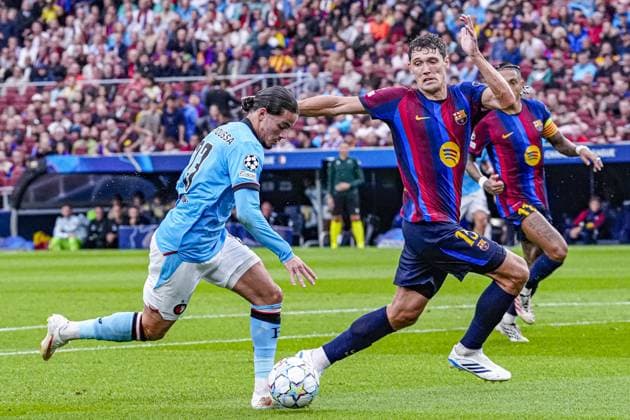 BARCELONA - Anis Hadj Moussa of Feyenoord battles for possession with Andreas Christensen of FC Barcelona, Barca during the UEFA Champions League match between FC Barcelona and Feyenoord at the Spotify Camp Nou on 09 September 2026 in Barcelona, Spain. GEERT VAN ERVEN ANP UEFA Champions League 2026 27 xVIxANPxSportx xMarcelxterxBalsxIVx 567773100 originalFilename: 567773100.jpg