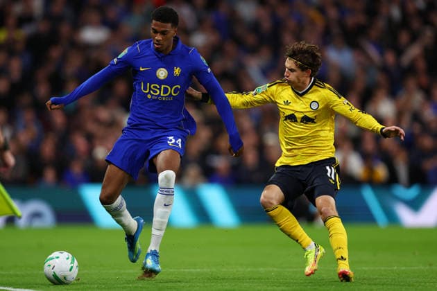 London, England, 9th September 2026. Josh Acheampong of Chelsea and Brenden Aaronson of Leeds United challenge for the ball during the Chelsea vs Leeds United Carabao Cup match at Stamford Bridge, London. Picture credit should read: Paul Terry Sportimage EDITORIAL USE ONLY. No use with unauthorised audio, video, data, fixture lists, club league logos or live services. Online in-match use limited to 120 images, no video emulation. No use in betting, games or single club league player publications. SPI_012_PT_Chelsea_Leeds SPI-4983-0012