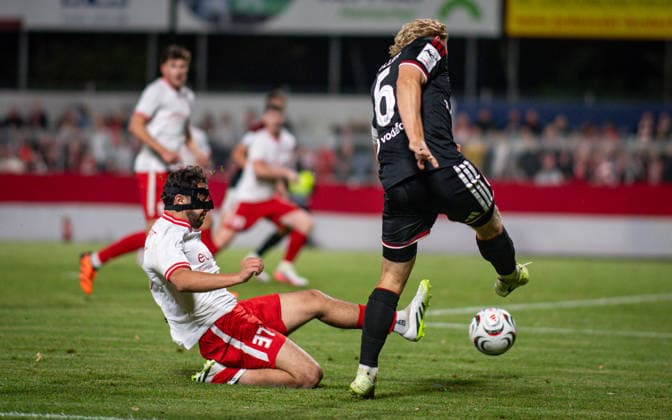 Soccer, 2026–2027 Season, Lower Rhine Cup, September 9, 2026, First Round, Men’s, SV Biemenhorst White vs. Fortuna Düsseldorf Black; from left: Amar Jalil (SV Biemenhorst), Andreas Mueller (Fortuna Düsseldorf); Bocholt, Stadion am Huenting, Germany 260909_fb_sv-biemenhorst_fortuna-duesseldorf_58676