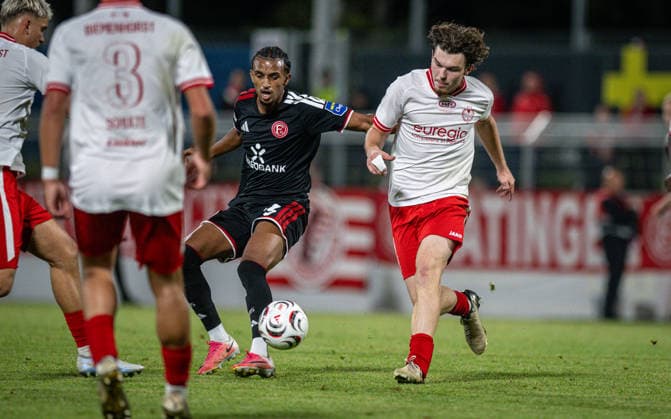 Soccer, 2026–2027 Season, Lower Rhine Cup, September 9, 2026, First Round, Men’s, SV Biemenhorst White vs. Fortuna Düsseldorf Black; from left: Filimon Gerezgiher (Fortuna Düsseldorf), Erik Monkos (SV Biemenhorst); Bocholt, Stadion am Huenting, Germany 260909_fb_sv-biemenhorst_fortuna-duesseldorf_58692