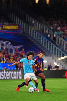 UEFA Champions League: FC Barcelona, Barca v Feyenoord Rotterdam Barcelona - Gjivai Zechiel of Feyenoord, Rodrigo Hernandez Cascante during the first round of the 2026 2027 UEFA Champions League season. The match is set between FC Barcelona and Feyenoord Rotterdam at Spotify Camp Nou on 9 September 2026 in Barcelona, Spain. Copyright: xTomxBodex