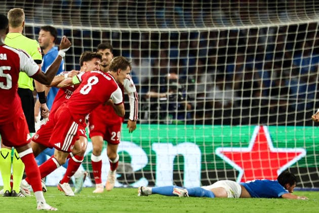 Martin Odegaard of Arsenal celebrates with team mates after scoring the goal of 0-1 during the UEFA Champions League 2026 2027 football match between SSC Napoli and Arsenal FC at Diego Armando Maradona stadium in Naples, (Italy), September 9, 2026. cesarexpurini