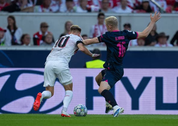 Henrik Bjordal of Viking FK fights for the ball with Chris Fuehrich of VfB Stuttgart during UEFA Champions League - Matchday 1 season 26 27 game between Stuttgart and Viking (Ruslan Taran Ball Raw Images) Stuttgart MHP Arena Germany Copyright: xRuslanxTaranx RUS_STUTT-VIKING-0096