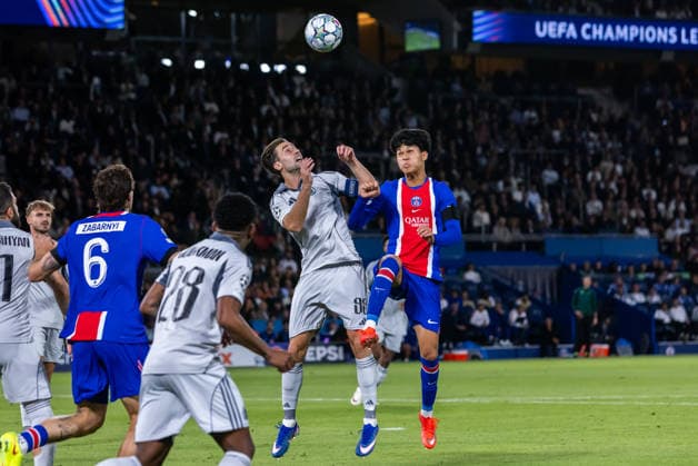 Andraz Sporar of SK Slovan Bratislava and Dro Fernandez of PSG during UEFA Champions league League phase game between teams PSG and SK Slovan Bratislava (Dominika Kortvelyesiova Ball Raw Images) Paris Parc des Princes France Copyright: xDominikaxKortvelyesiovax DKR_9334