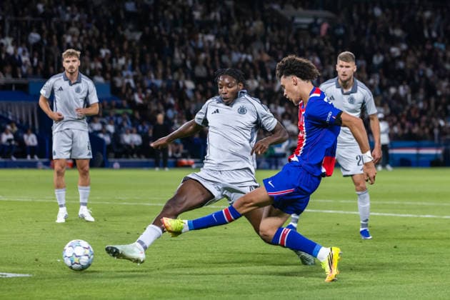 Sahmkou Camara of SK Slovan Bratislava and Maghnes Akliouche of PSG during UEFA Champions league League phase game between teams PSG and SK Slovan Bratislava (Dominika Kortvelyesiova Ball Raw Images) Paris Parc des Princes France Copyright: xDominikaxKortvelyesiovax DKR_9359