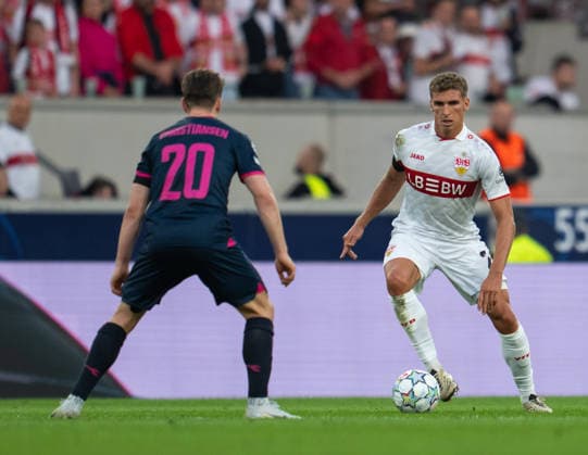 Peter Christiansen of Viking FK defends against Grischa Proemel of VfB Stuttgart during UEFA Champions League - Matchday 1 season 26 27 game between Stuttgart and Viking (Ruslan Taran Ball Raw Images) Stuttgart MHP Arena Germany Copyright: xRuslanxTaranx RUS_STUTT-VIKING-0199