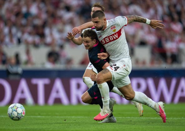 Zlatko Tripic of Viking fights for the ball with Julian Chabot of Stuttgart during UEFA Champions League - Matchday 1 season 26 27 game between Stuttgart and Viking (Ruslan Taran Ball Raw Images) Stuttgart MHP Arena Germany Copyright: xRuslanxTaranx RUS_STUTT-VIKING-0202