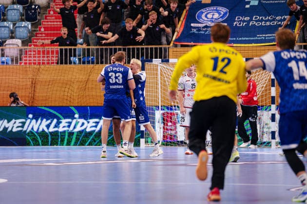 2 Handball Bundesliga 2, Matchday 1: VfL Potsdam vs. TV 05 07 Hüttenberg. Markus Mahr (1, VfL Potsdam), 6, Tim Niclas Schröder 1 VfL Potsdam, 33, and Tim Hildenbrand 1 VfL Potsdam, 20 celebrate after scoring a goal on September 9, 2026, at the MBS Arena in Potsdam, Brandenburg, Germany