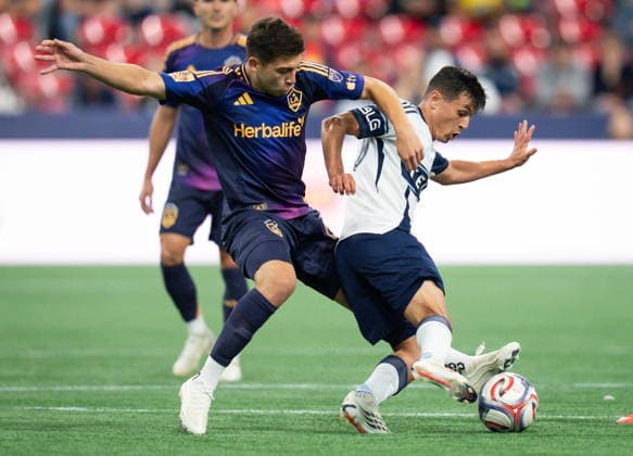 September 9, 2026, Vancouver, Bc, CANADA: Los Angeles Galaxy s Lucas Sanabria, left, and Vancouver Whitecaps Andres Cubas vie for the ball during the second half of an MLS, Fussball Herren, USA soccer match in Vancouver on Wednesday, Sept. 9, 2026. Canada News - September 9, 2026 - ZUMAc35_ 20260909_zaf_c35_167 Copyright: xEthanxCairnsx