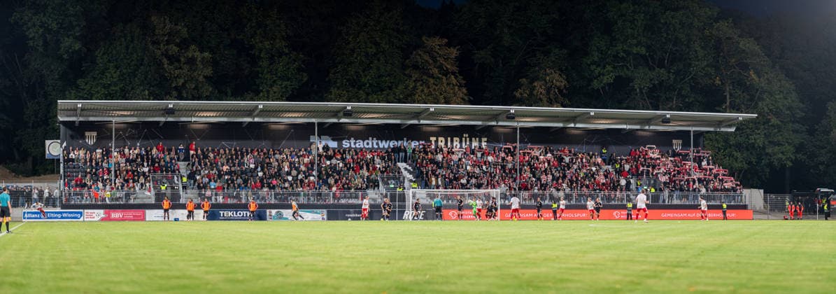 Soccer, 2026–2027 Season, Lower Rhine Cup, September 9, 2026, First Round, Men s Division, SV Biemenhorst (White) vs. Fortuna Düsseldorf (Black), Stadtwerker Stand, Bocholt, Stadion am Huenting, Germany 260909_fb_sv-biemenhorst_fortuna-duesseldorf_58665-Pano