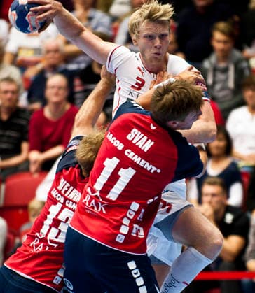 Drotts Philip Stenmalm is stopped by Flensburgs Lasse Svan during the Champions League match between Drott and Flensburg on September 25, 2013, in Halmstad, Sweden  Copyright: xAvdoxBilkanovicx