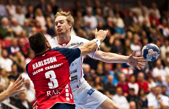 Magnus Persson of Drott and Tobias Karlsson of Flensburg during the Champions League match between Drott and Flensburg on September 25, 2013, in Halmstad, Sweden  Copyright: xAvdoxBilkanovicx