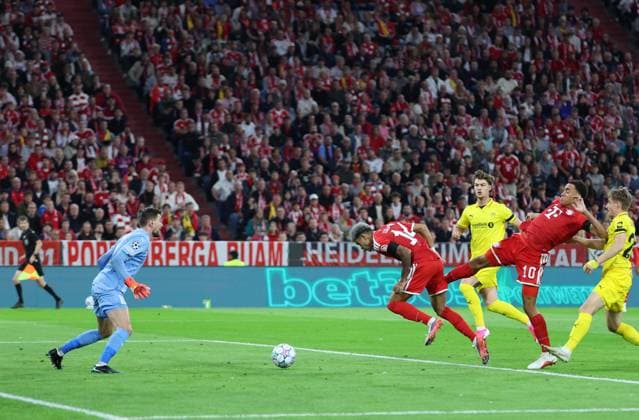 September 10, 2026, GER, Soccer, Men s, UEFA Champions League, Group Stage, 2026–2027 Season, Matchday 1, FC Bayern Munich vs. FK Bodø Glimt; Jamal Musiala (FC Bayern Munich) No. 10 takes a shot on goal against goalkeeper Nikita Haikin (FK Bodø Glimt) No. 12 on the left; Luis Diaz (FC Bayern Munich) No. 14; Munich, Allianz Arena, Bayern, Germany Copyright: xNordphoto Schneiderx