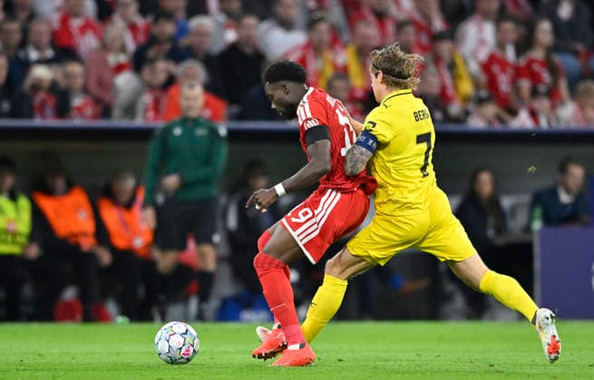 Tackle, Action: Patrick Berg (FK Bodø Glimt 07) vs. Alphonso Davies (Bayern Munich FCB) 19 FC Bayern Munich FCB vs. Bodø Glimt 10 09 2026 DFL REGULATIONS PROHIBIT ANY USE OF PHOTOGRAPHS AS IMAGE SEQUENCES AND OR QUASI-VIDEO: FC Bayern Munich (FCB) vs. Bodø Glimt