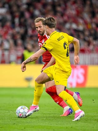 Harry Kane of FC Bayern Munich and Villads Nielsen of FK Bodo Glimt battle for the ball during the 2026–2027 UEFA Champions League match between Bayern Munich and Bodo Glimt at Fussball Arena Munich on September 10, 2026 in Munich, Germany. Photo by Harry Langer, DeFodi Images
