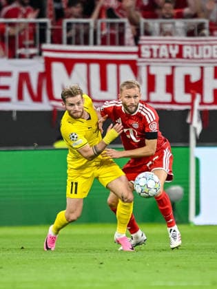 Ole Didrik Blomberg of FK Bodo Glimt and Konrad Laimer of FC Bayern Munich battle for the ball during the 2026–2027 UEFA Champions League match between Bayern Munich and Bodo Glimt at Fussball Arena Munich on September 10, 2026 in Munich, Germany. Photo by Harry Langer, DeFodi Images