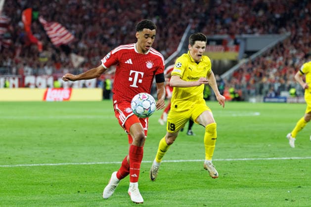 Jamal Musiala, 10, FC Bayern Munich, with Sondre Brunstad Fet, 19, FK Bodo Glimt, in the background during the match between FC Bayern Munich and FK Bodo Glimt, soccer, men s, UEFA Champions League, 2026–2027, Matchday 1 on September 10, 2026, in Munich, Allianz Arena, Bavaria, Germany