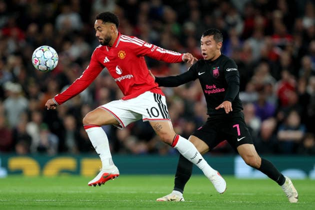 Manchester United, ManU v Sabah FC - UEFA Champions League 2026 27 League Phase MD1 Matheus Cunha of Manchester United and Umarali Rakhmonaliev of Sabah challenge during the UEFA Champions League 2026 27 League Phase MD1 match between Manchester United and Sabah FC at Old Trafford on September 10, 2026 in Manchester, England. Manchester Old Trafford England United Kingdom Copyright: xAllstarxPicturexLibraryxLtdx