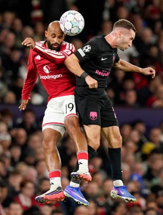 Manchester, England, 10th September 2026. Bryan Mbeumo of Manchester United, ManU challenges Veljko Simic of Sabah FC during the Manchester United vs Sabah UEFA Champions League match at Old Trafford, Manchester. Picture credit should read: Andrew Yates Sportimage EDITORIAL USE ONLY. No use with unauthorised audio, video, data, fixture lists, club league logos or live services. Online in-match use limited to 120 images, no video emulation. No use in betting, games or single club league player publications. SPI_030_AY_Man_Utd_Sabah SPI-4989-0030