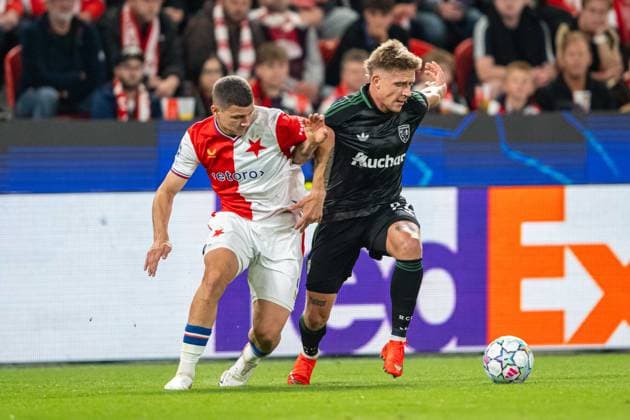 Oskar Kubiak and Michael Cuisance in a battle during UEFA Champions league match, SK Slavia Praha - RC Lens , 10 september 2026, Fortuna Arena, Praha, Czech republic Copyright: xMICHALxFAJT,ZOSPORTU.SKx MAJ_3736